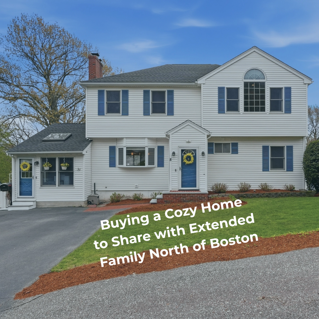 Exterior of a spacious multigenerational home north of Boston with separate entrance potential, blue front doors, landscaped yard, and text overlay reading “Buying a Cozy Home to Share with Extended Family North of Boston.