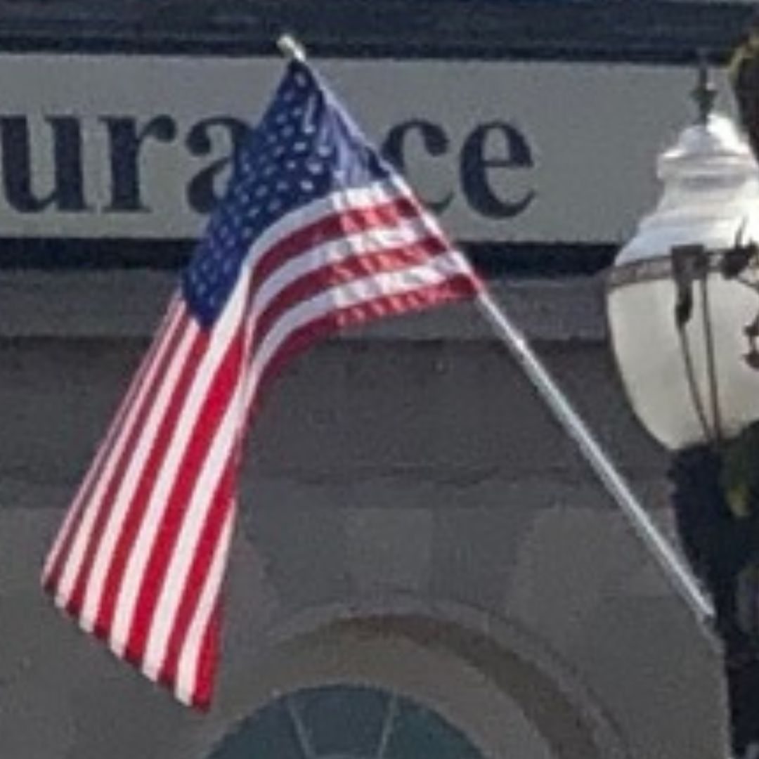 the American Flag flying in Woburn Center