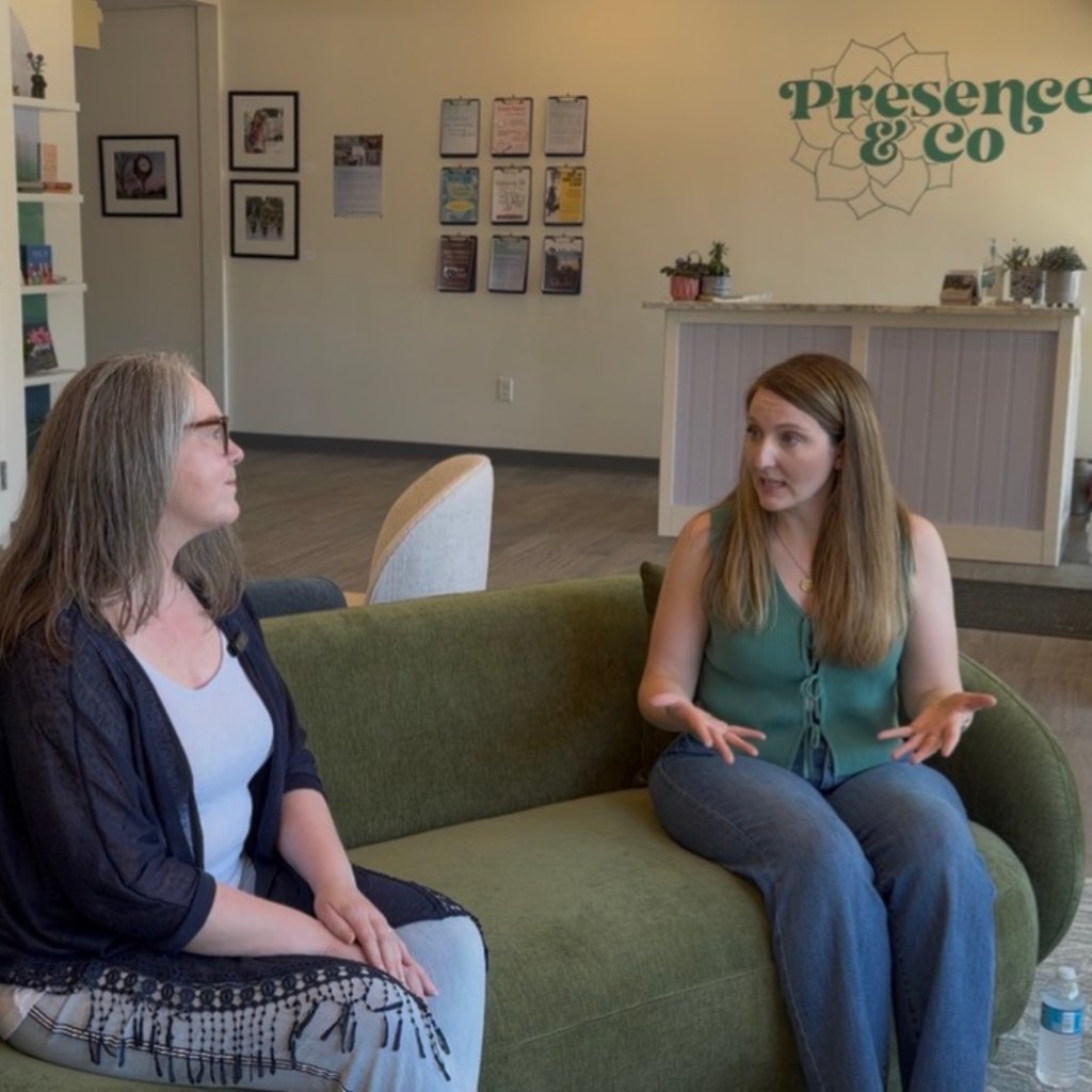 Jodi Crowley sits with the founder and owner of Presence & Co in the welcoming lobby during a featured interview for North of Boston Lifestyle. The conversation highlights the business, its mission, and its role in supporting the local community.