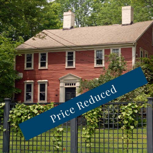 Classic Massachusetts home with "Price Reduced" banner